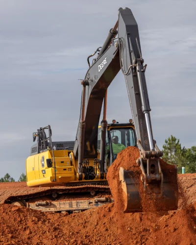 Heavy-duty forestry mulching equipment quickly and efficiently clearing dense brush and trees to create a build-ready site.