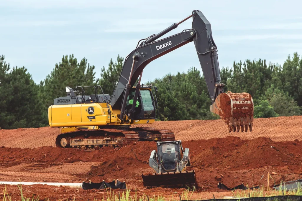 An expert grading contractor from Bray Siteworks leveling and compacting the soil for a new development project in Georgia.