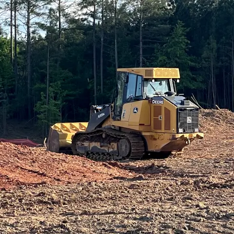 A Bray Siteworks excavator performing professional land clearing and high-capacity earthmoving services to prepare a new construction site.