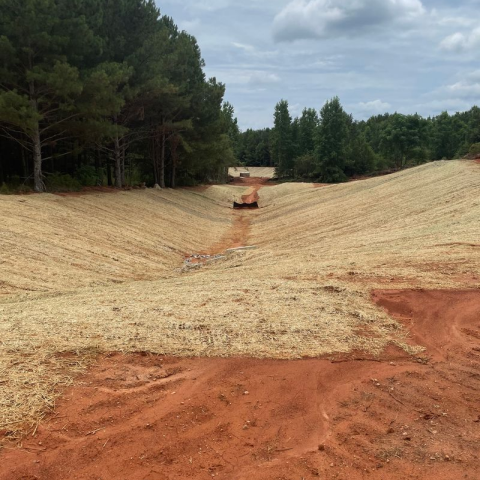 Precise pad grading and site works preparation for a new residential development in Watkinsville, Georgia, ensuring a completely build-ready site.